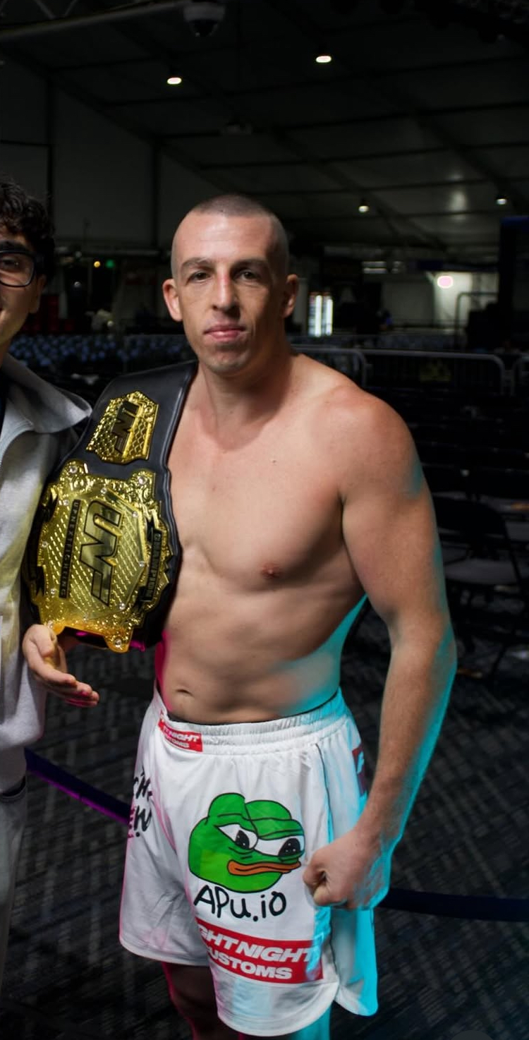 Tommy Aaron posing with the UNF championship belt